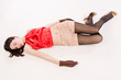 Photo: Lifeless brunette lying on the floor Lifeless brunette lying on the floor