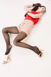 Photo: Lifeless brunette lying on the floor Lifeless brunette lying on the floor
