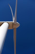 Wind turbine, close against blue sky