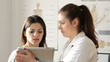Female doc explaining something in tablet to patient