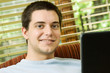 Photo: Teen boy on laptop at home Teen boy on laptop at home