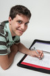 Photo: Teen boy doing homework Teen boy doing homework