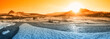 wide river with snow and ice at sunset
