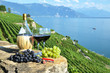 Photo: Red wine and grapes. Lavaux region, Switzerland Red wine and grapes. Lavaux region, Switzerland