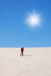 man with cross-country skiing up the hill