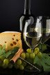 white wine and cheese on black