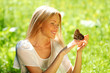 Foto: Woman playing with a butterfly Woman playing with a butterfly