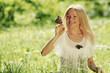 Foto: Woman playing with a butterfly Woman playing with a butterfly