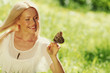 Foto: Woman playing with a butterfly Woman playing with a butterfly