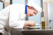 Chef preparing a dish in a restaurant's kitchen