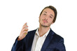 Photo: Attractive young man spraying perfume, using fragrance Attractive young man spraying perfume, using fragrance