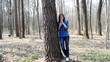 beautiful girl standing near the tree