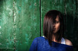 pretty young girl in front of old house