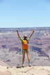 Happy hiker by Grand Canyon south rim cheering