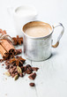 Coffee in aluminum mug with spices