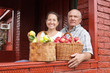 Senior man and woman with apples