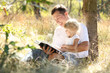 Foto: father with his little daughter reads the Bible father with his little daughter reads the Bible