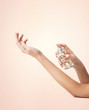 woman hands spraying perfume