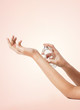woman hands spraying perfume