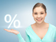 girl showing sign of percent in her hand