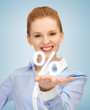 woman showing sign of percent in her hand