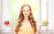 young beautiful woman with green and red apples