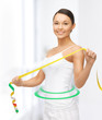 sporty woman with measuring tape