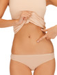 woman pointing at her abs