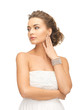 woman with pearl earrings and bracelet
