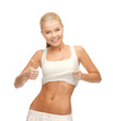 sporty woman showing thumbs up