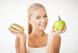 woman with apple and hamburger
