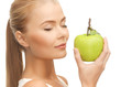 woman smelling apple