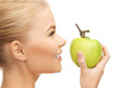 woman smelling apple
