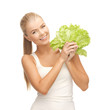 woman holding lettuce