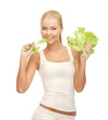 woman biting lettuce