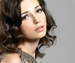Beautiful sexy woman with broun curly hairs