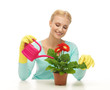 housewife with flower in pot and watering can