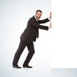 Businessman pushing away something