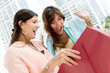 Photo: Women looking into a shopping bag Women looking into a shopping bag