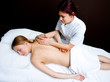 woman having chiropractic back adjustment