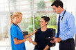 woman handshaking with nurse after checkup