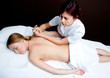 woman having chiropractic back adjustment
