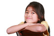 Photo: Happy little girl, resting chin on arms, smiling Happy little girl, resting chin on arms, smiling