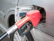 Photo: Gasoline nozzle filling up a car Gasoline nozzle filling up a car