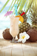 Pina Colada cocktail on the beach with copy space
