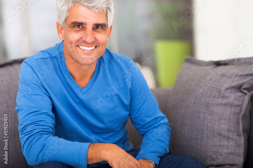 Photo: mature man relaxing at home mature man relaxing at home