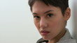 Video: Serious young Asian young woman looking at camera Serious young Asian young woman looking at camera