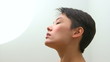 Beautiful Mixed Race woman looking into light