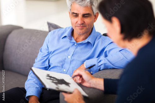 Photo: middle aged man in session with therapist middle aged man in session with therapist
