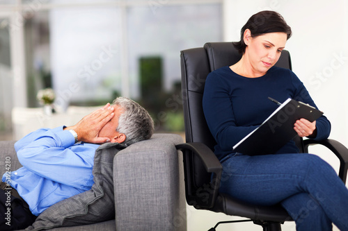 Photo: middle aged man crying during session with therapist middle aged man crying during session with therapist